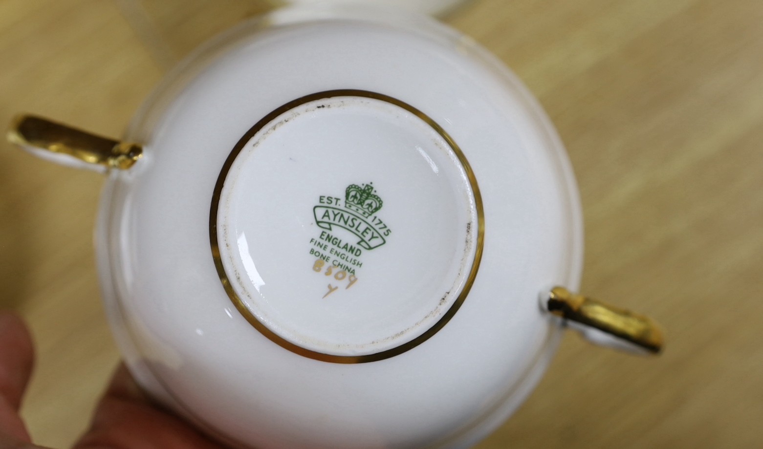 An Aynsley blue and gilt part dinner service